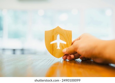 Shield protect icon with plane icon, Security protection. The concept of travel insurance, covering medical expenses, emergency medical evacuation, trip delays, trip interruptions, and lost baggage.