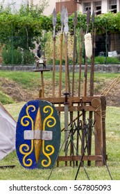 A shield, a set of spears and other weapons in ancient celtic encampment
