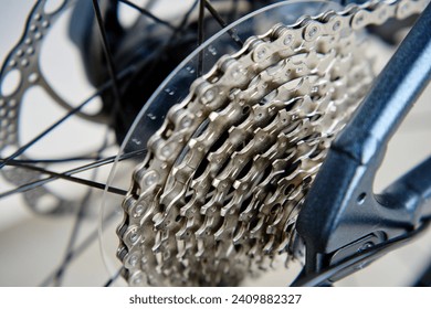Shifting gears on rear transmission of bicycle. Bicycle gear drivetrain and cassette, close up. Maintenance bike transmission
