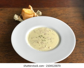 Shiitake Mushroom Soup In A Large Plate And Served On The Dining Table.