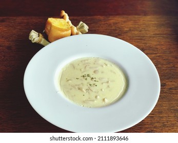 Shiitake Mushroom Soup In A Large Plate And Served On The Dining Table.