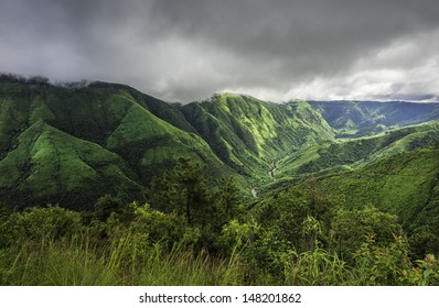 Shillong, Meghalaya, India. Storm clouds gather over the Khasi Hills as dawn breaks over the deep valley gorges flanked by forested slopes near Cherrapunjee, Meghalaya, India.