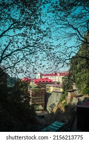 Shimla, Himachal pardesh, India : 14th, May 2022 - Indra Gandhi medical College (IGMC) Shimla campus under the beautiful tree branches and bluish sky.