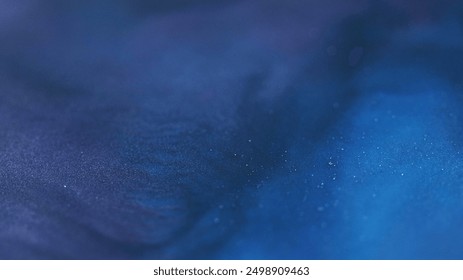 Shimmering flow. Glitter wave. Blur blue color paint shiny glowing twinkle particles texture dark abstract magical art background. - Powered by Shutterstock