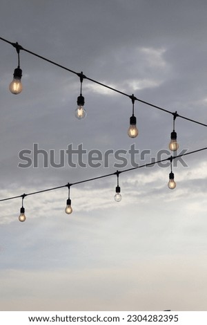 shimmering lamps in series on a evening