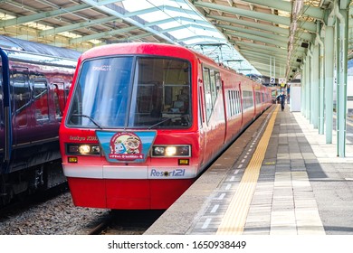 SHIMODA, SHIZUOKA, JAPAN - JAN 25, 2020: Izukyu Red 2100 series "Kinme Express (Seabream express)" scenic train with seabream theme stopping at Izu Shimoda station