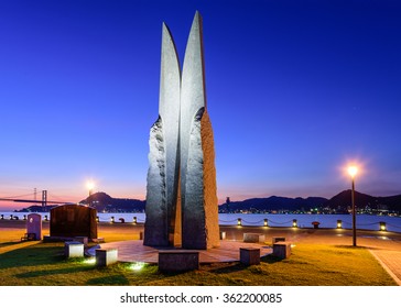 SHIMONOSEKI, JAPAN - AUGUST 26, 2015: The Tower Of Youth Symphony Monument At The Karato Pier. The Karato Pier Runs Along The Kanmon Straits Of Japan.