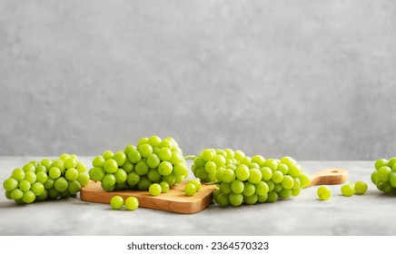 Shine Muscat, Green grapes on a cutting board - Powered by Shutterstock