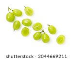 A lot of Shine-Muscat grapes and cut Shine-Muscat grapes on a white background. White grapes.  Japanese grapes. View from above
