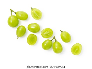 A lot of Shine-Muscat grapes and cut Shine-Muscat grapes on a white background. White grapes.  Japanese grapes. View from above