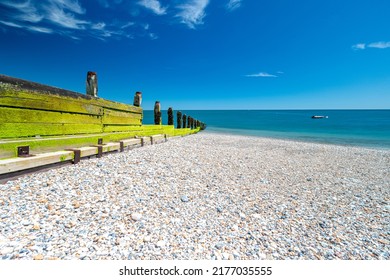 Shingle beach in hot weather in Selsey, West Sussex. Low, wide angle persepective