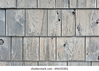 shingles discolored and worn by the weather