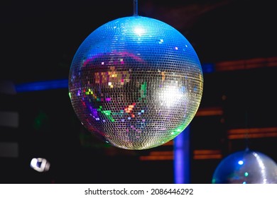 Shining disco ball in a discotheque