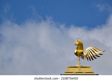 Shining Golden Bird Taking Flight From The Roof Of A Japanese Temple