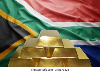 Shining Golden Bullions On The South Africa Flag Background