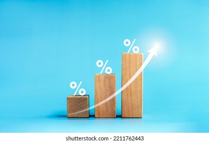 Shining rise up arrow on wooden cube blocks, bar graph chart steps with percentage 3d icons on blue background, business growth process, profit, wealth, leader trends, economic improvement concepts.