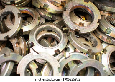 Shining Wheel Mounting Nuts Car, Tractor, Truck, Heavy Machinery Close Up. Industrial Background.