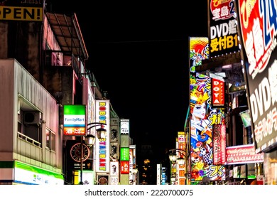 Shinjuku, Japan - April 3, 2019: Famous Red Light Tokyo District Kabukicho Alley Street In Downtown City With Neon Bright Lights Signs For Stores, Shops And Clubs Restaurants At Night