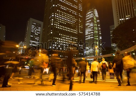 Shinjuku Tokyo Blurred light motion people walk on street in the city night Japan 