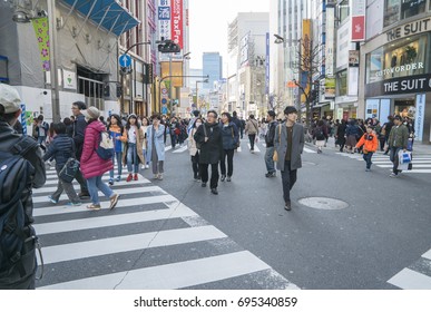 Shinjuku, Tokyo, Japan - April 02, 2017: Japanese and tourists walking and shopping at Shinjuku (large entertainment, business and shopping area around Shinjuku Station)