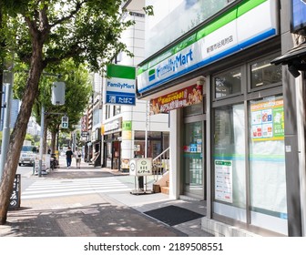 Shinjuku, Tokyo, Japan. August 12, 2022. The Storefront Shot From A Busy Shaded Sidewalk Of A FamilyMart, A Popular Japanese Convenience Store On A Bright Sunny Summer Afternoon. 