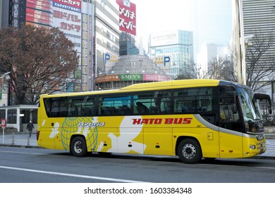 SHINJUKU/TOKYO, JAPAN - DECEMBER 31, 2019: Hato Bus Sightseeing Buses Are Parking In Front Of Shinjuku Station. Hato Bus Offers Tour Services In Multiple Languages.