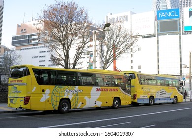 SHINJUKU/TOKYO, JAPAN - DECEMBER 31, 2019: Hato Bus Sightseeing Buses Are Parking In Front Of Shinjuku Station. Hato Bus Offers Tour Services In Multiple Languages.