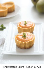 Shinny Mango Cheesecake On White Plate On White Background