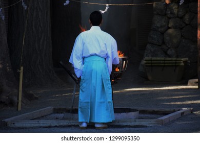 Shinto Priest And Bonfire