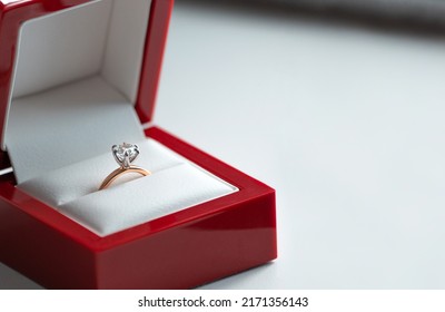 Shiny Beautiful Engagement Ring With Big Gem Diamond In Rich Red Velvet Box Isolated On White Background.Copy Space, Front Top View, Background