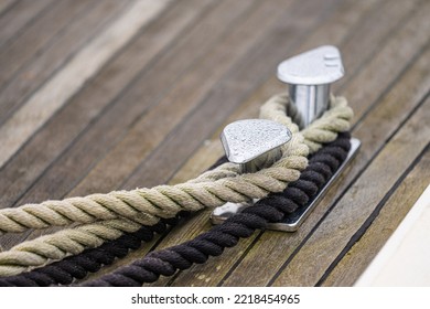 Shiny Bollards On A Wooden Boat Deck.