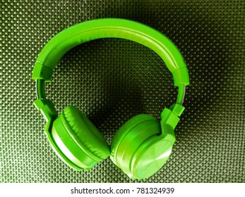 Shiny Colorful Headphones In Carbon Fibre Background