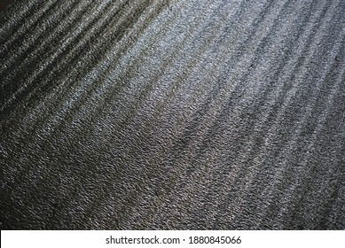 Shiny dark background for design. Surface for decoration.