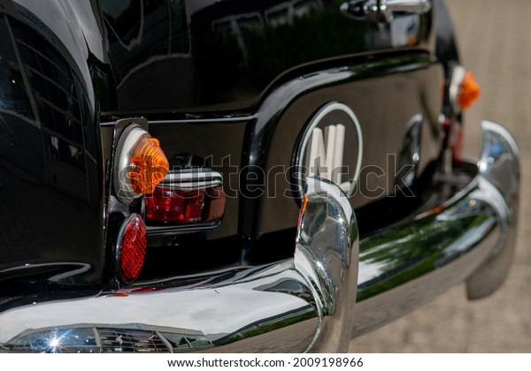Shiny details from the back of an antique car photo\
made 16 july 2021