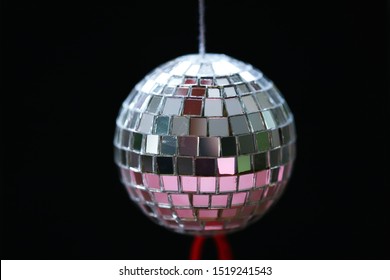 Shiny disco ball closeup black texture blur background