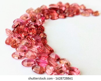 Shiny Facet Gemstone Pink Sapphire Padparadscha Spinel Oval Shape On White Background With Macro Selective Focus 