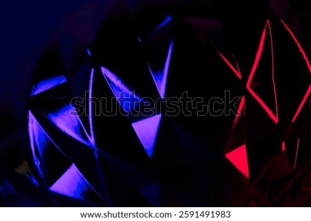 Shiny geodesic shapes with reflections of red and blue