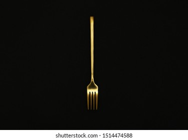 Shiny Gold Fork On Black Background, Top View