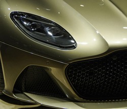 Shiny Luxury Golden Color Sports Car Headlight, Grille And Front Splitter Close Up View