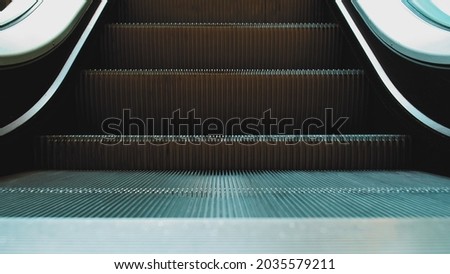 Shiny Metal Escalator Moving Stairs
