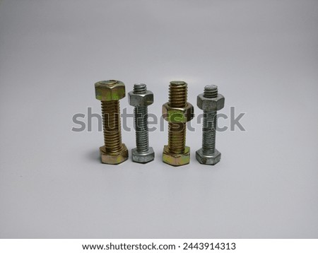 Shiny metal hexagonal bolts and nuts in various sizes for DIY projects