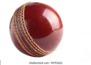 A Shiny, New Test Match Cricket Ball, Isolated On A White Background.