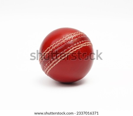 A Shiny New Test Match Cricket Ball Leather Hard Circle Stitch Closeup Picture On White Background