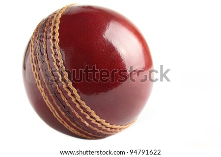 A shiny, new test match cricket ball, isolated on a white background.