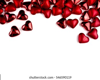 Shiny red hearts on a white background with copy space