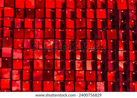 Shiny red mosaic in the shape of squares, disco texture beautiful background