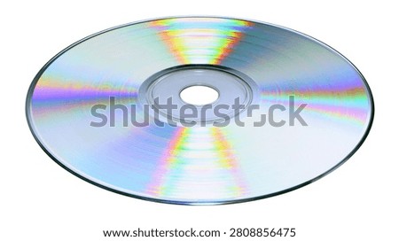 Shiny reflective compact disc with rainbow iridescent light diffraction pattern