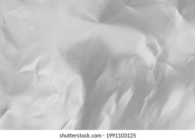 Shiny Silver Foil Texture Background, Pattern Of Wrapping Paper With Crumpled And Wavy.