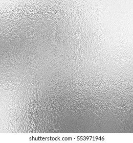 Shiny silver foil texture, grey metallic decorative background - Shutterstock ID 553971946