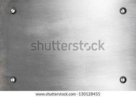 Shiny silver metallic plate with bolts